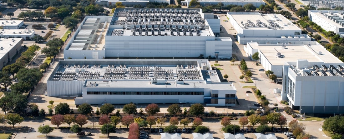 An overhead image of an AI data center in the middle of a suburban area.