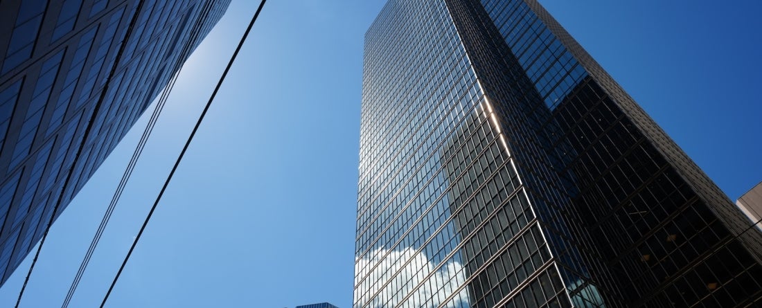 City skyscraper view from below.