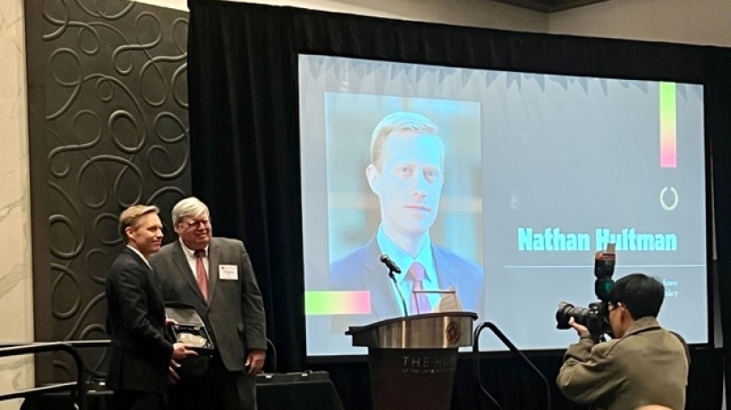 picture of Nate Hultman receiving the Exemplary Researcher award at the Maryland Research Excellence Awards.